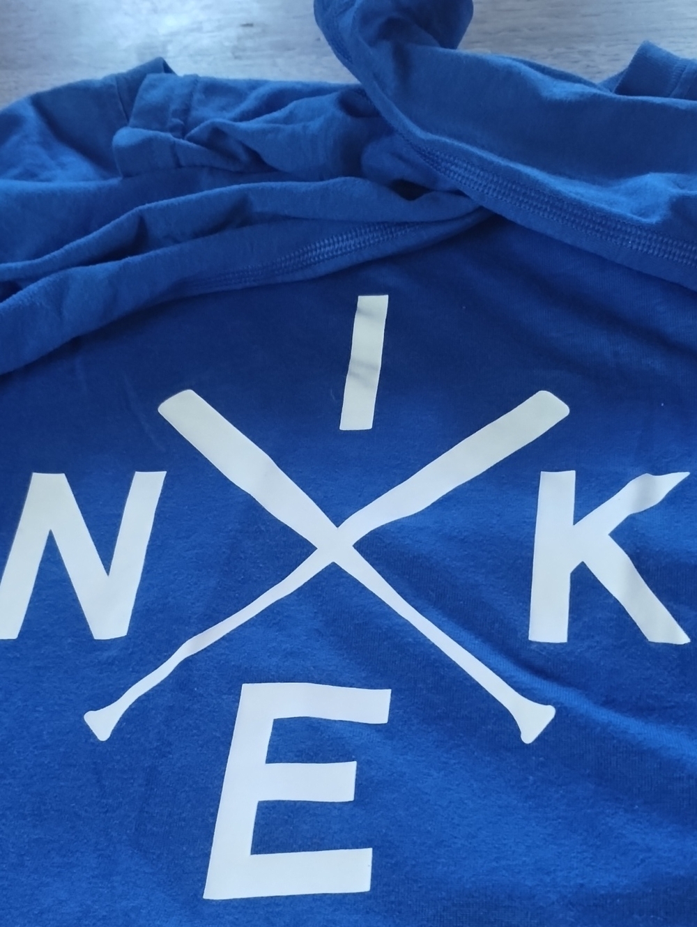Nike Blue Short Sleeve T-Shirt with White Crossed Paddle Graphic